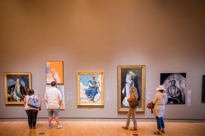 Visitors explore Early American Art Galleries at Crystal Bridges Museum of American Art in Bentonville, Arkansas.